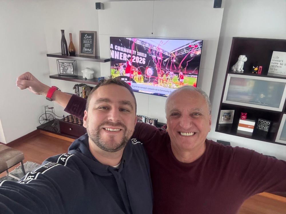 Celebrating with my dad at home in Lima as Arsenal lift the Community Shield on TV